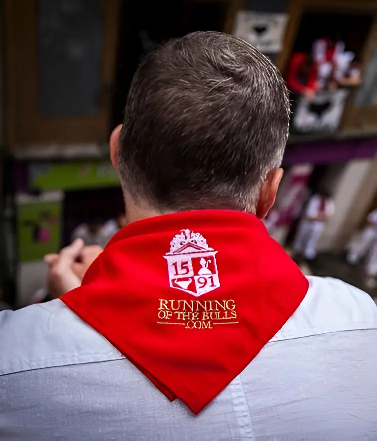 A man wearing a red bandana with the words " isf 2 0 1 3 " on it.