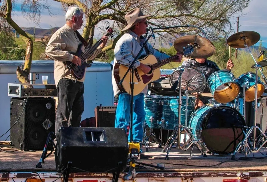 A group of people playing instruments on stage.